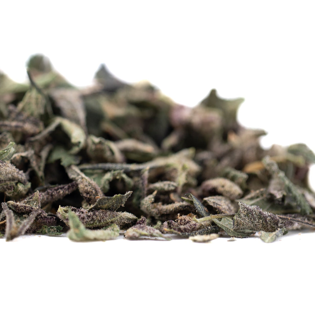 Banana Kush THCa trim with green purple herbal tea leaves