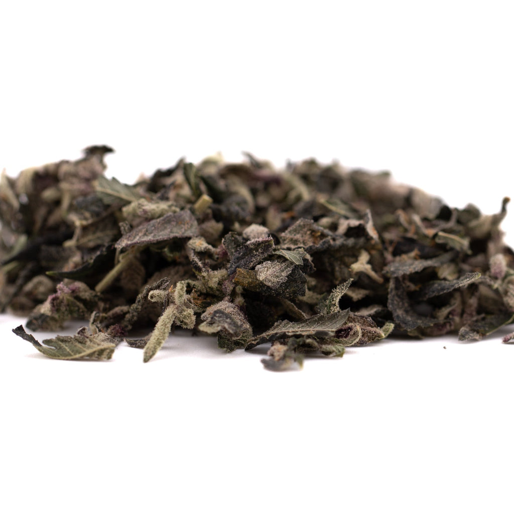 Pile of dried green tea leaves for Candy Mac Indoor Trim Wholesale 1LB product
