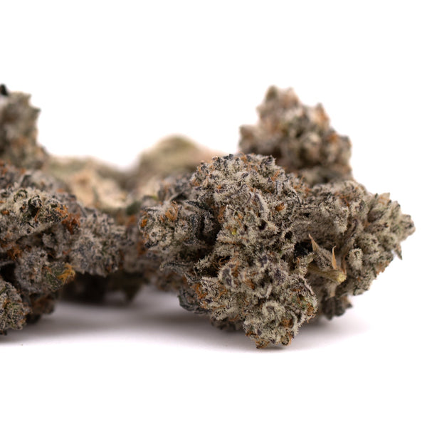 Dense frosty cannabis buds from Fire OG THCa Indoor Flower, a premium thca indoor hemp flower