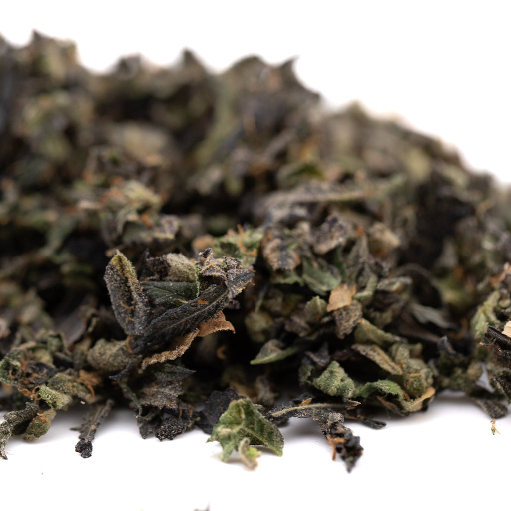 Dried green herbs from Lemon OG Indoor Trim, featuring THCA trim and sugar leaves