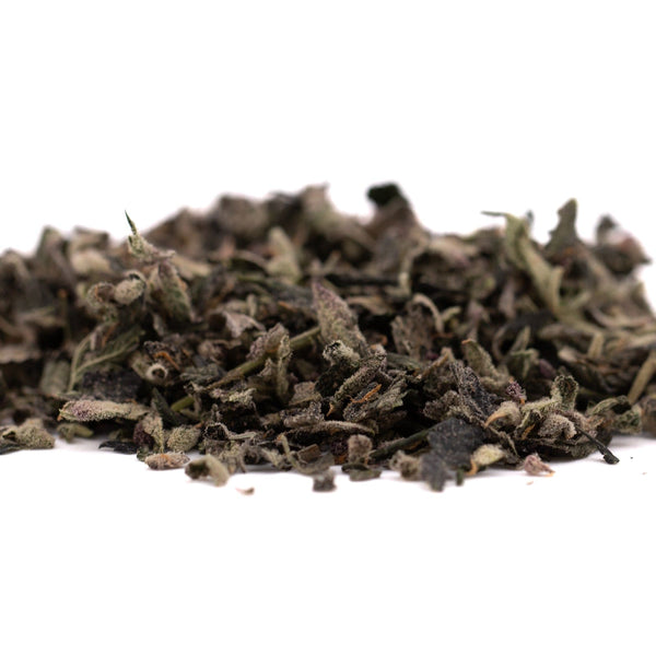 Pile of dried green tea leaves showing THCA trim for wholesale sugar leaves in Mac and Gary Indoor Trim 1LB